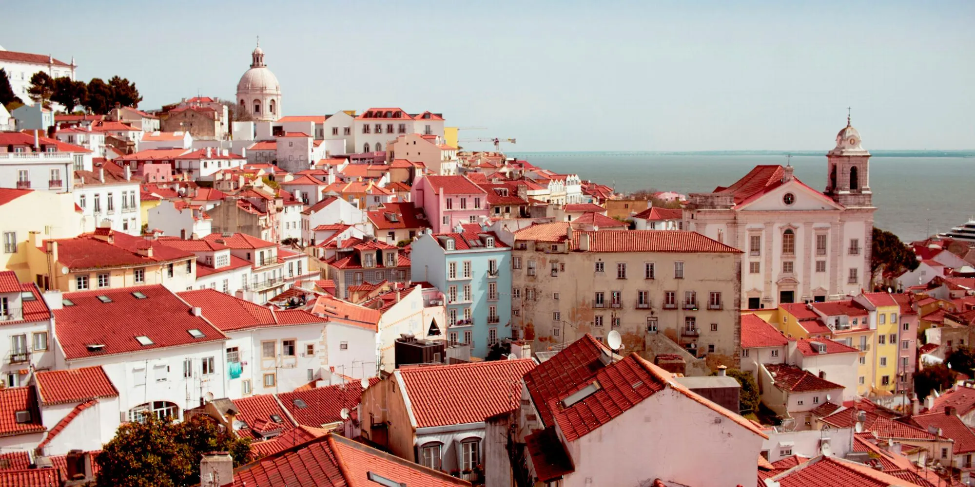 Alfama rooftops above the Tagus