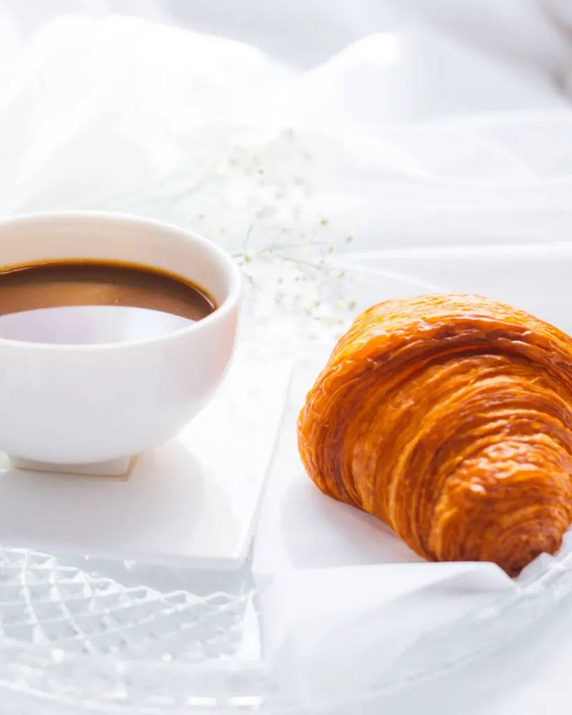Coffee and a croissant before the city wakes